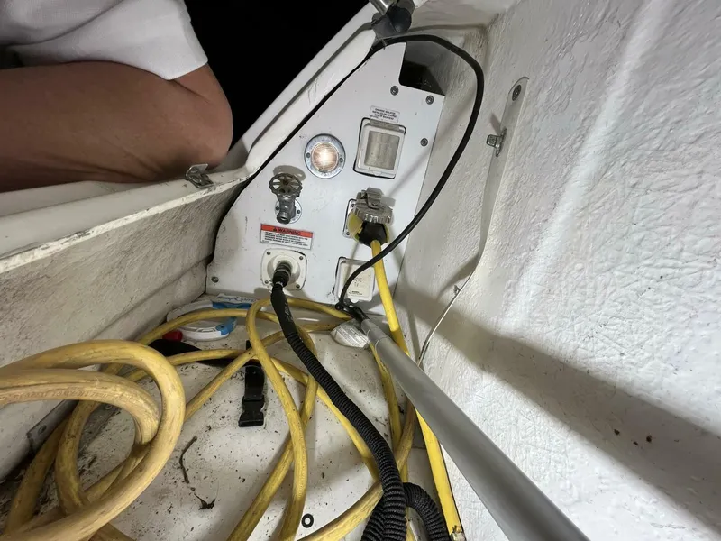 Slide: The Image of Electrical panel and cables in a 2007 Sea Ray 280 Sundancer boat. - 13