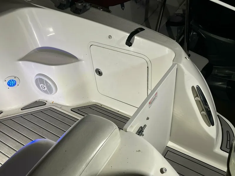 Slide: The Image of 2007 Sea Ray 280 Sundancer boat interior with seating and storage compartment. - 14