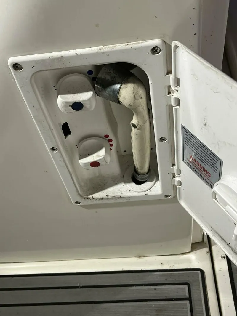 Slide: The Image of 2007 Sea Ray 280 Sundancer shower controls with open access panel. - 16