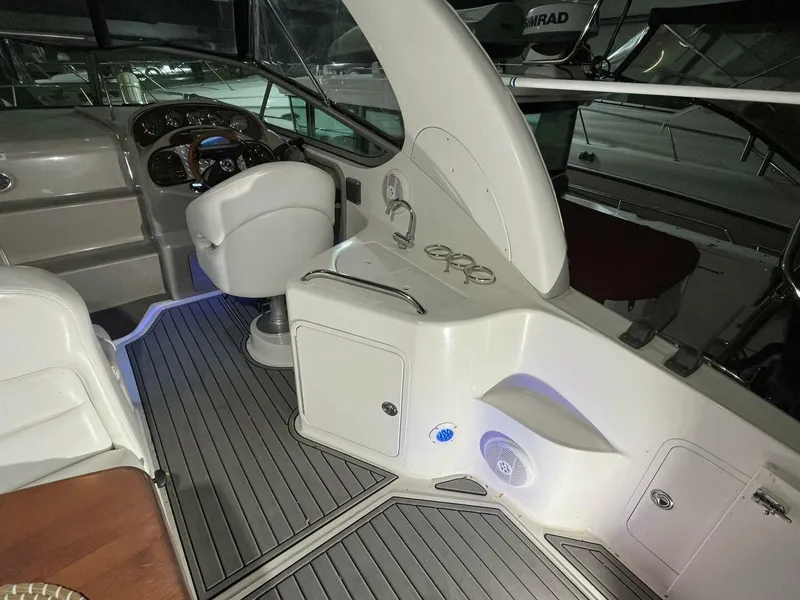 Slide: The Image of 2007 Sea Ray 280 Sundancer cockpit with helm, seating, and modern controls. - 22