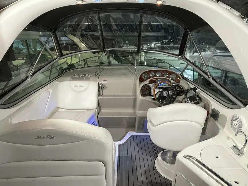Slide: The Image of 2007 Sea Ray 280 Sundancer boat interior with helm, seating, and dashboard. - 25