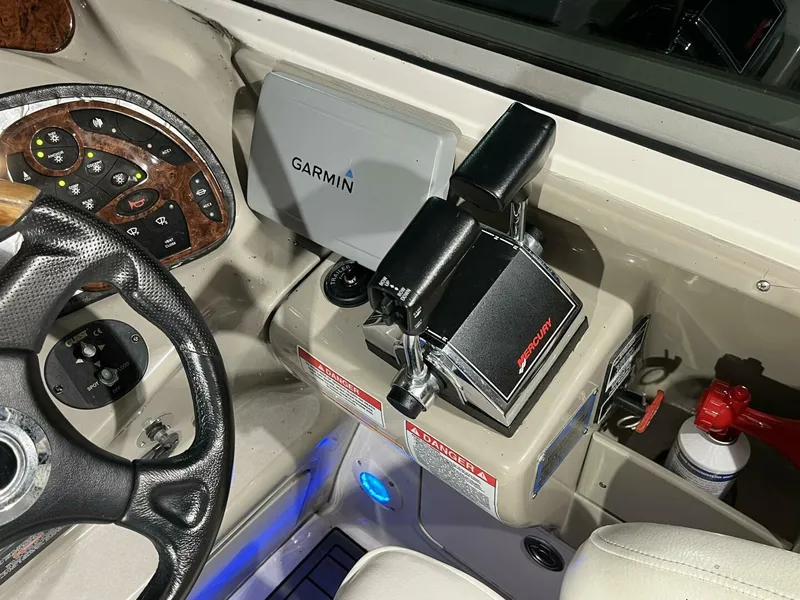 Slide: The Image of 2007 Sea Ray 280 Sundancer helm with Garmin GPS and controls. - 33