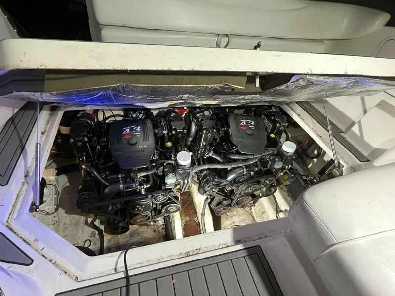 Slide: The Image of 2007 Sea Ray 280 Sundancer engine compartment with twin MerCruiser engines. - 35