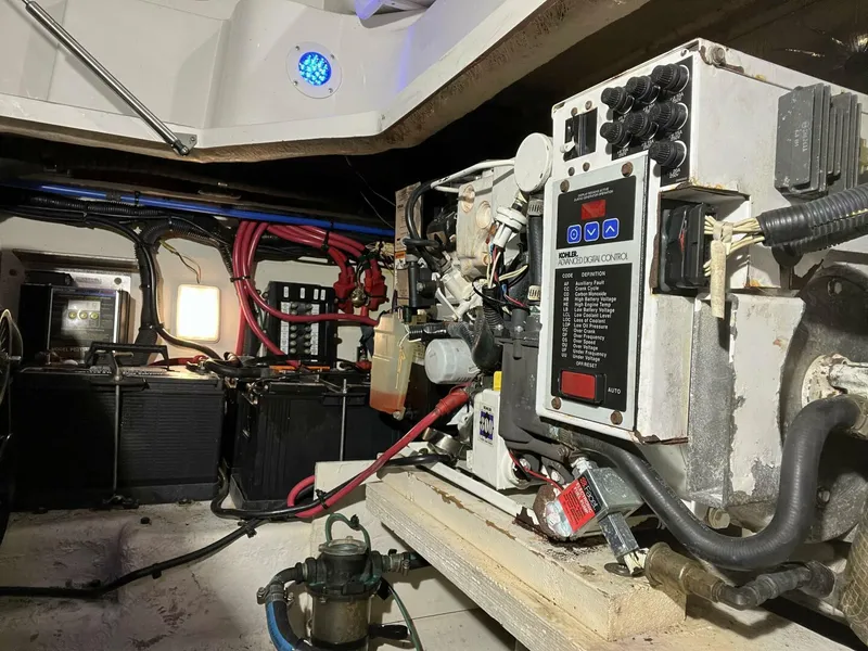 Slide: The Image of Engine room of a 2007 Sea Ray 280 Sundancer with visible wiring and control panel. - 39