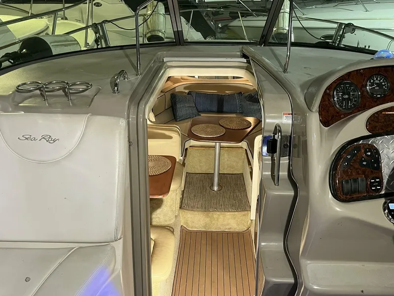 Slide: The Image of 2007 Sea Ray 280 Sundancer cabin interior with seating and dashboard view. - 42