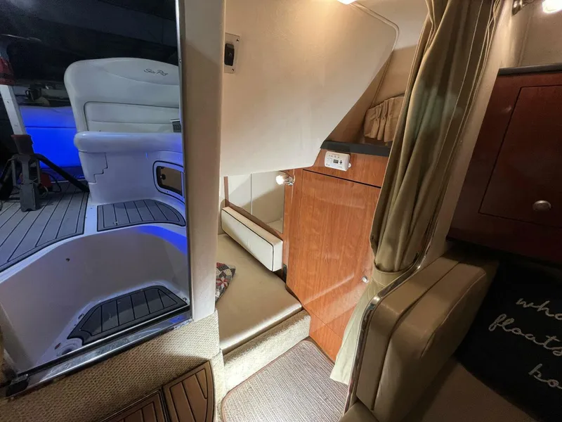 Slide: The Image of Interior of 2007 Sea Ray 280 Sundancer boat, featuring seating and cabin area. - 46