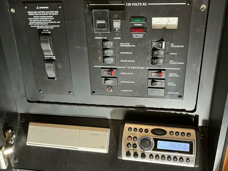 Slide: The Image of Electrical control panel of 2007 Sea Ray 280 Sundancer boat with stereo system. - 48