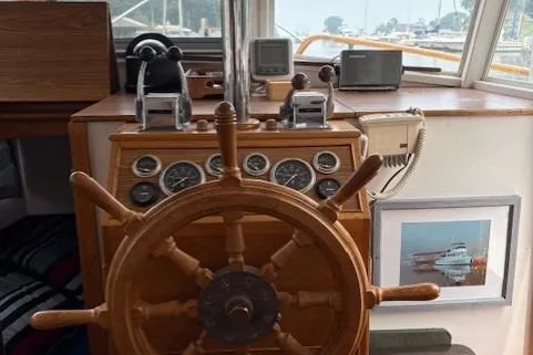 Slide: The Image of 1978 Grand Banks 36 Classic helm with wooden wheel and navigation instruments. - 18