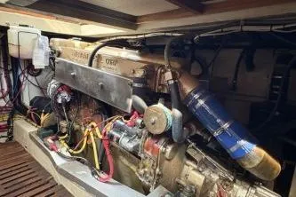 Slide: The Image of Engine room of a 1978 Grand Banks 36 Classic boat, showcasing mechanical components. - 29