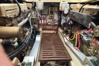 Slide: The Image of Engine room of 1978 Grand Banks 36 Classic, showcasing mechanical components and wiring. - 32