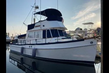 Slide: The Image of 1978 Grand Banks 36 Classic yacht docked at marina, side view. - 33