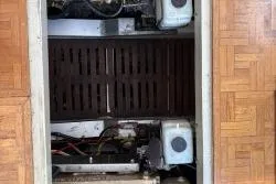 Slide: The Image of Engine compartment of a 1978 Grand Banks 36 Classic boat, showcasing mechanical components. - 35