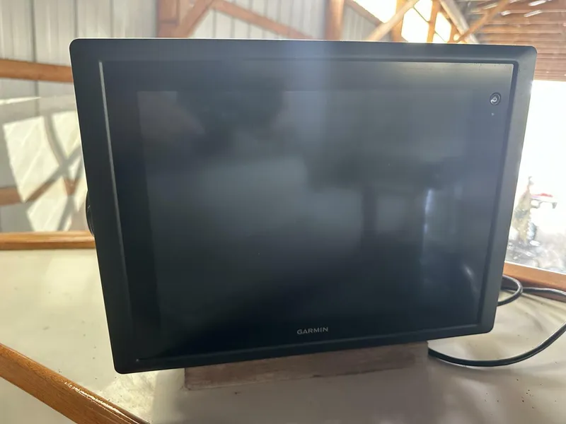 Slide: The Image of Garmin marine display on 1978 Grand Banks 36 Classic boat, indoor setting. - 8