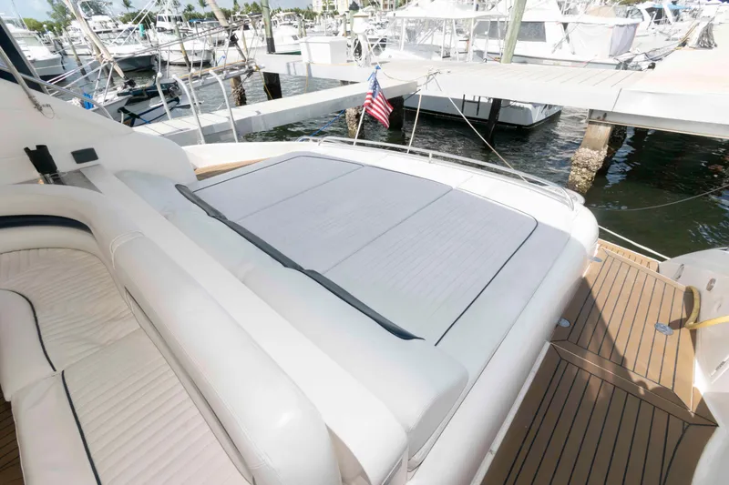 Slide: The Image of 2003 Viking Princess V50 Express yacht with spacious deck and seating at marina. - 11