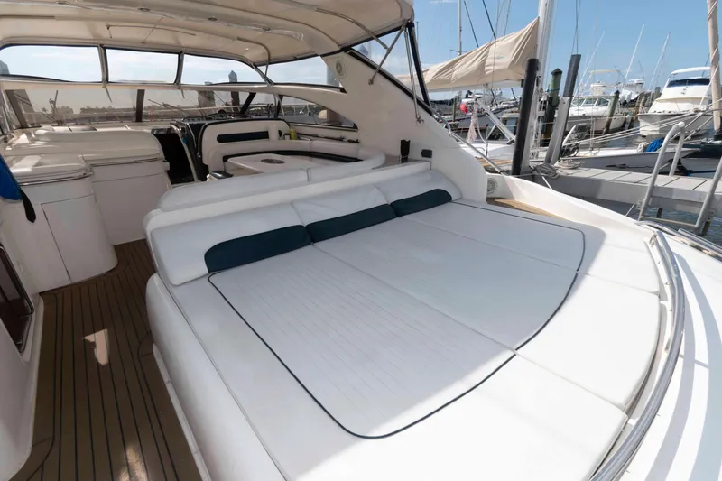 Slide: The Image of 2003 Viking Princess V50 Express yacht with spacious deck and luxurious seating. - 12