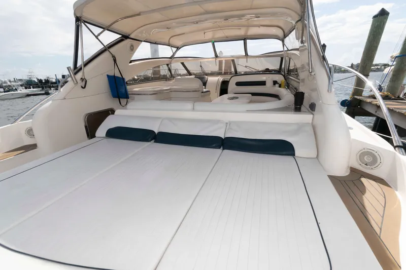 Slide: The Image of 2003 Viking Princess V50 Express yacht with spacious deck and seating area. - 13