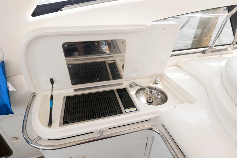 Slide: The Image of Outdoor kitchenette on 2003 Viking Princess V50 Express yacht with grill and sink. - 14