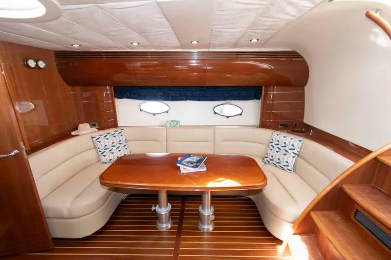 Slide: The Image of Luxurious interior of 2003 Viking Princess V50 Express yacht with elegant seating and wooden table. - 20