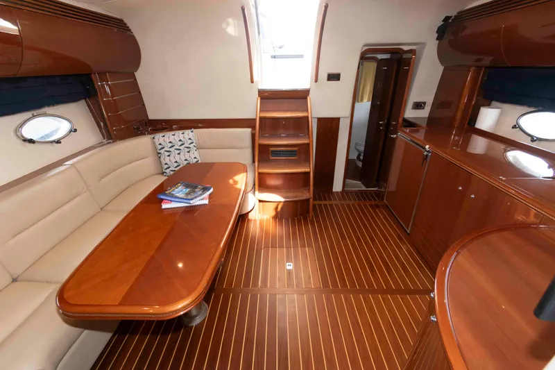 Slide: The Image of Luxurious interior of 2003 Viking Princess V50 Express yacht with elegant wood finishes. - 22
