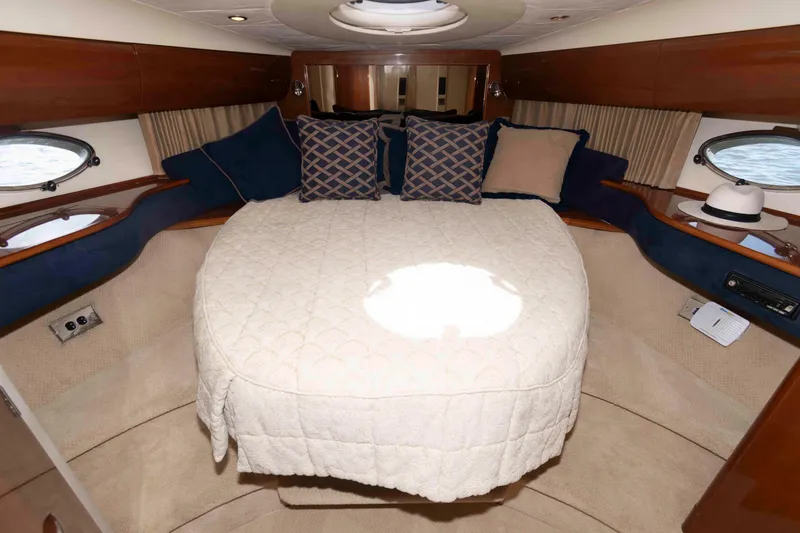 Slide: The Image of Luxurious cabin interior of 2003 Viking Princess V50 Express yacht with cozy bedding. - 23