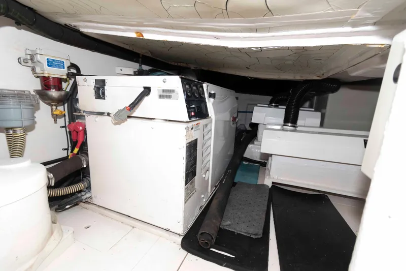 Slide: The Image of Engine room of 2003 Viking Princess V50 Express yacht, showcasing machinery and equipment. - 29