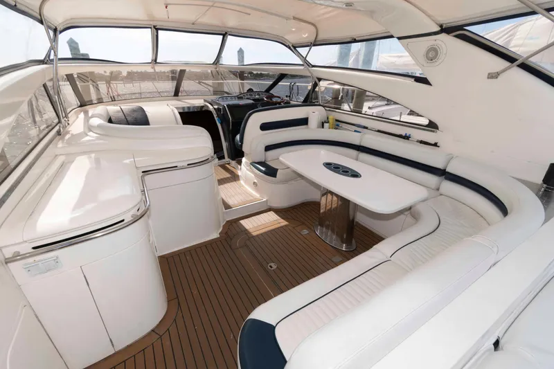 Slide: The Image of Luxurious interior of 2003 Viking Princess V50 Express yacht with elegant seating and table. - 3