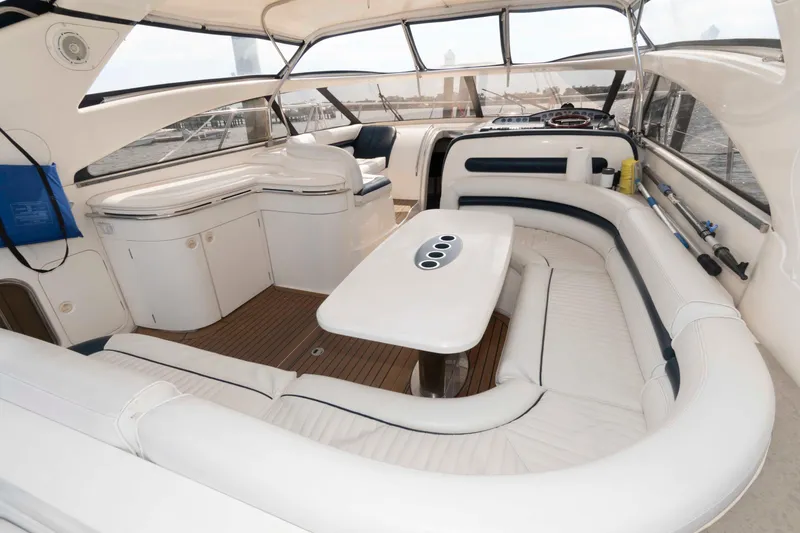 Slide: The Image of Luxurious interior of 2003 Viking Princess V50 Express yacht with white seating and wooden flooring. - 4