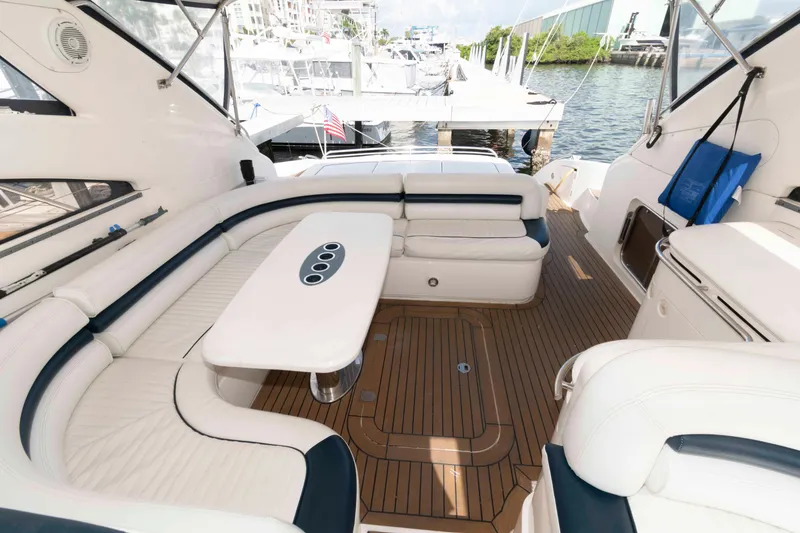 Slide: The Image of Luxurious 2003 Viking Princess V50 Express yacht interior with elegant seating and wooden flooring. - 5