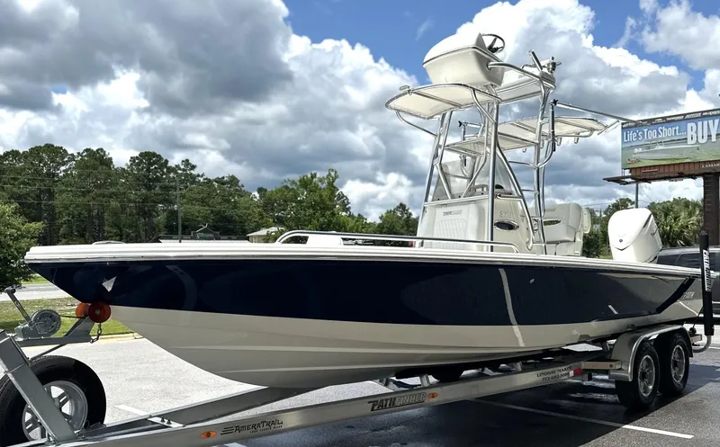 Slide: The Image of 2025 Pathfinder 2600 TRS boat on trailer under cloudy sky. - 13