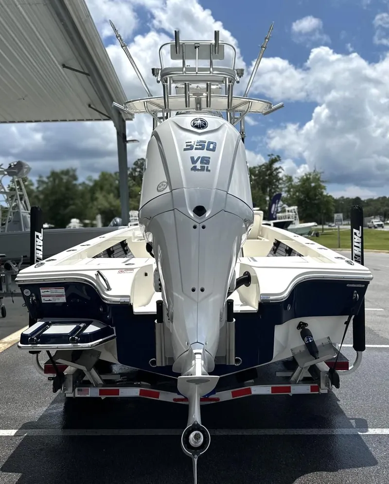 Slide: The Image of 2025 Pathfinder 2600 TRS boat with powerful 350 V6 engine, parked outdoors. - 18