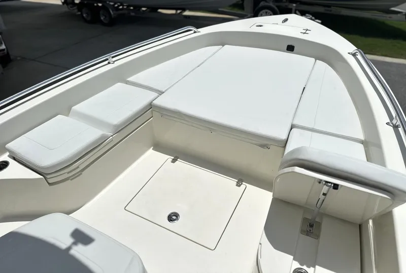 Slide: The Image of 2025 Pathfinder 2600 TRS boat interior with cushioned seating and storage compartments. - 20