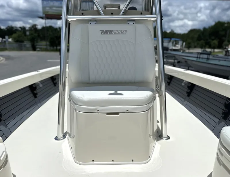 Slide: The Image of 2025 Pathfinder 2600 TRS boat interior with white seating and stainless steel frame. - 22