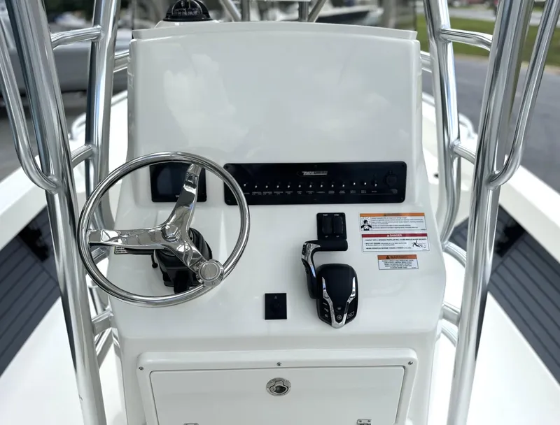 Slide: The Image of 2025 Pathfinder 2600 TRS boat console with steering wheel and controls. - 3