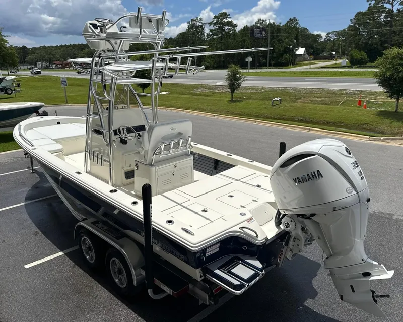 Slide: The Image of 2025 Pathfinder 2600 TRS boat with Yamaha engine on trailer in parking lot. - 4