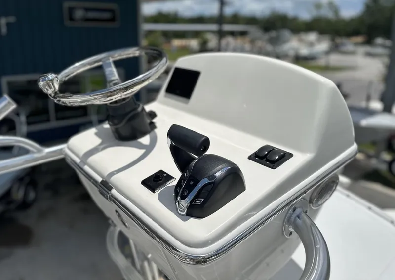 Slide: The Image of 2025 Pathfinder 2600 TRS boat console with steering wheel and controls. - 8