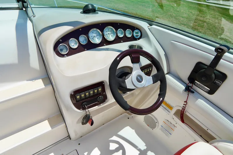 Slide: The Image of 2003 Chaparral 225 SSi boat dashboard with steering wheel and instrument panel. - 10