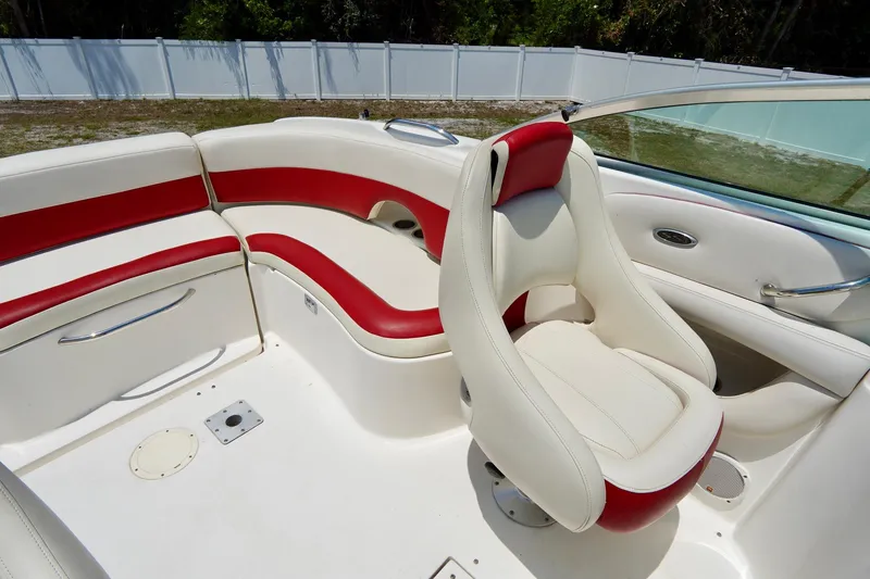 Slide: The Image of 2003 Chaparral 225 SSi boat interior with red and white seating. - 11