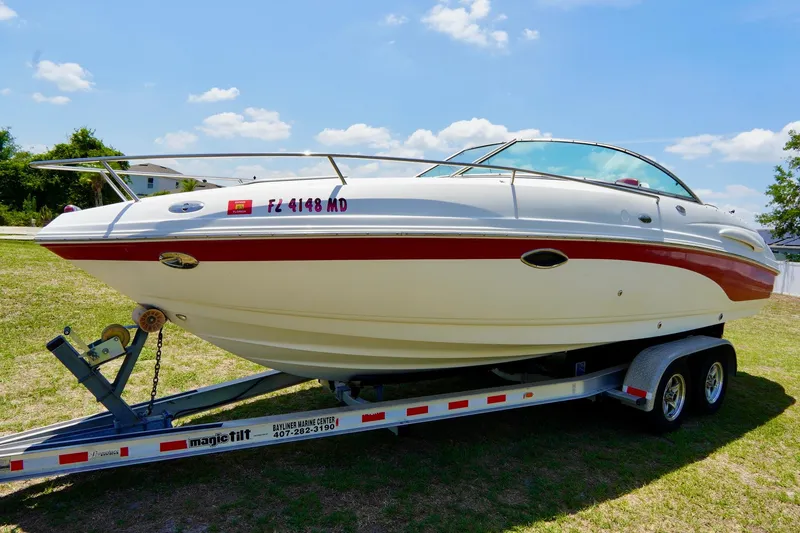 Slide: The Image of 2003 Chaparral 225 SSi boat on trailer under clear blue sky. - 2