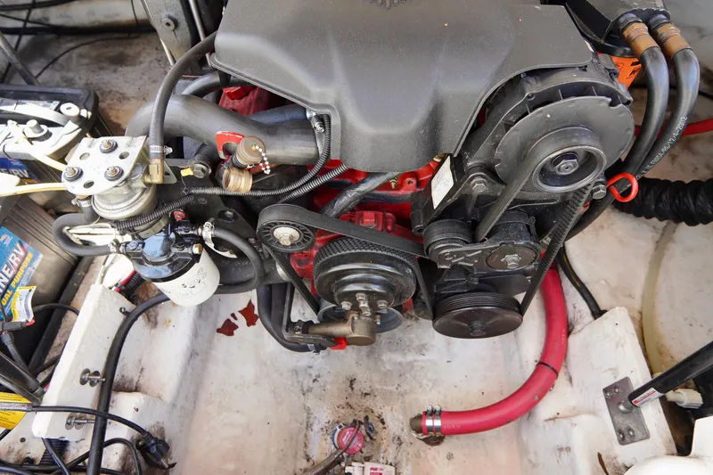 Slide: The Image of Engine compartment of a 2003 Chaparral 225 SSi boat, showcasing mechanical components. - 20