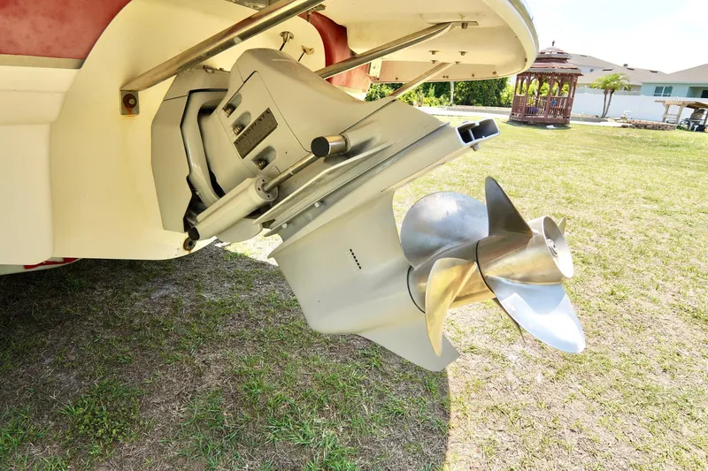 Slide: The Image of 2003 Chaparral 225 SSi boat propeller and stern drive on grass. - 27