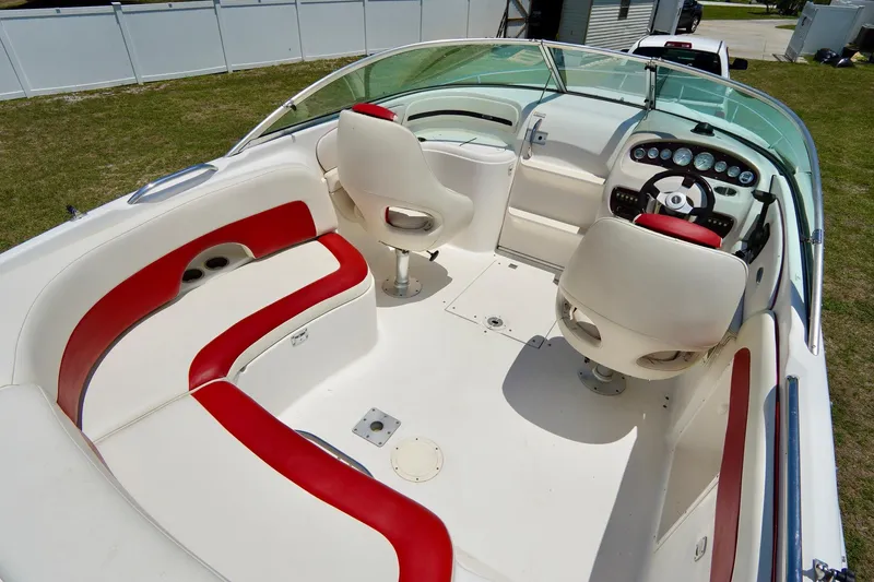 Slide: The Image of 2003 Chaparral 225 SSi boat interior with red and white seating, steering console. - 6