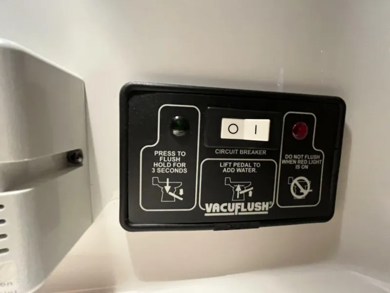 Slide: The Image of Control panel for VacuFlush system on a 2005 Chris-Craft Corsair 28 boat. - 37