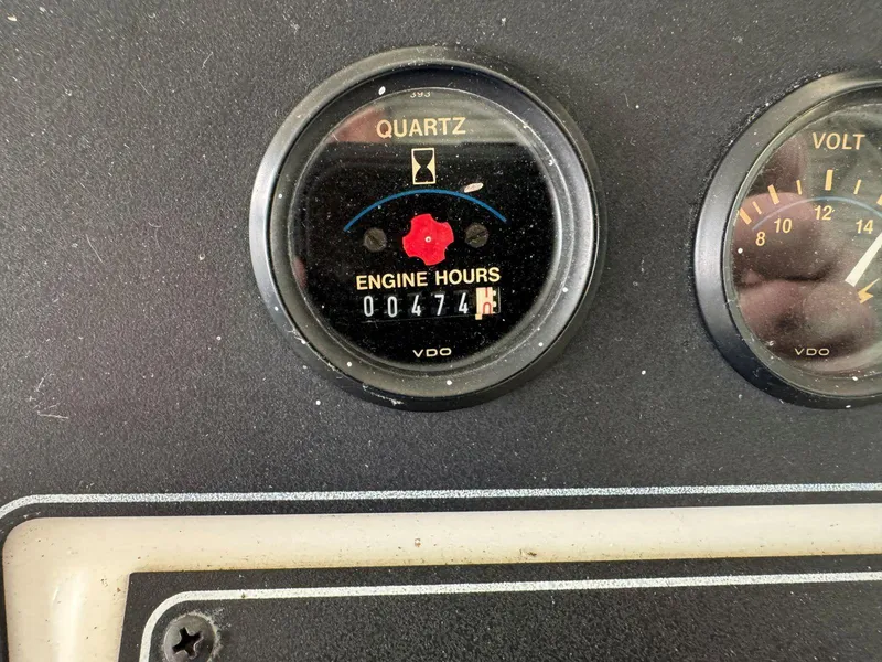 Slide: The Image of 1994 Carver 350 Aft Cabin engine hour meter showing 474 hours. - 16