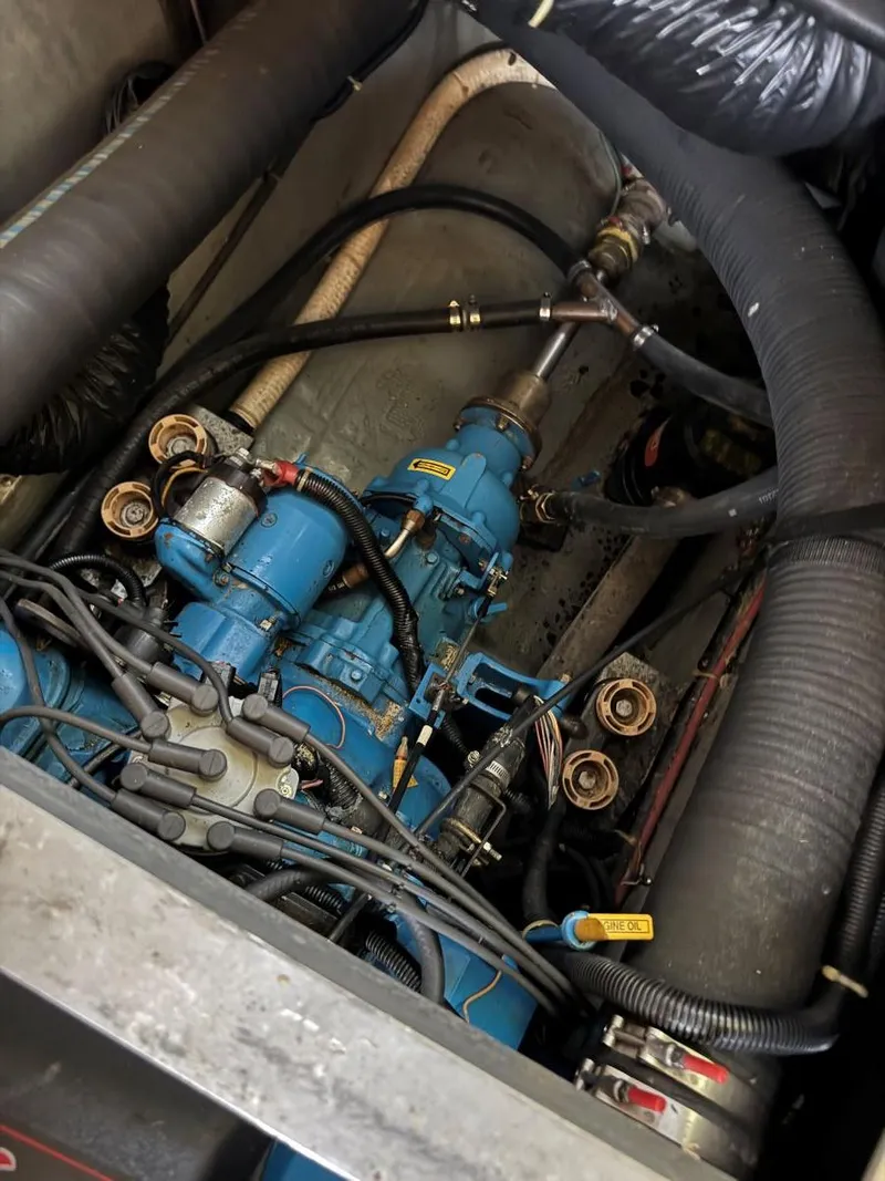 Slide: The Image of Engine compartment of a 1994 Carver 350 Aft Cabin boat, showcasing mechanical components. - 36