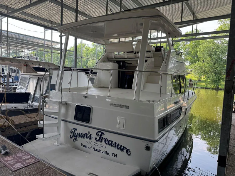 Slide: The Image of 1994 Carver 350 Aft Cabin yacht docked, named "Tyson's Treasure," Port of Nashville, TN. - 4