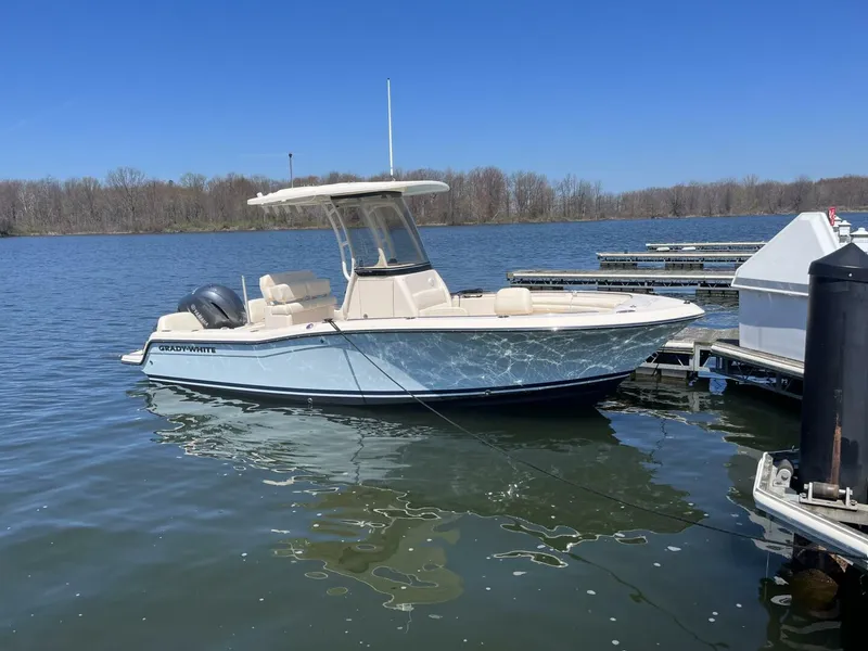 The Image of 2023 Grady-White Fisherman 216 boat docked on a calm lake. - 0