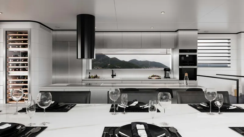 Slide: The Image of Luxurious modern kitchen with sleek design, featuring a wine cooler and scenic window view. - 17