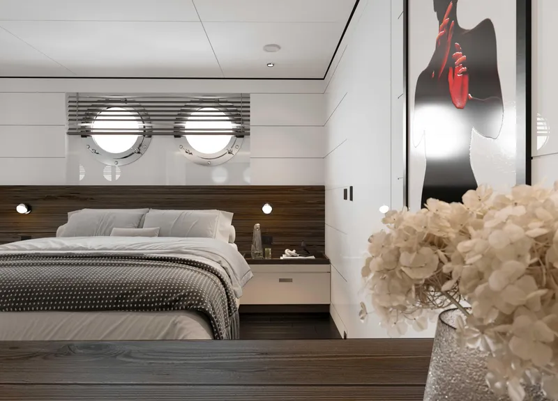 Slide: The Image of Luxurious yacht bedroom with modern decor, featuring porthole windows and elegant floral arrangement. - 22