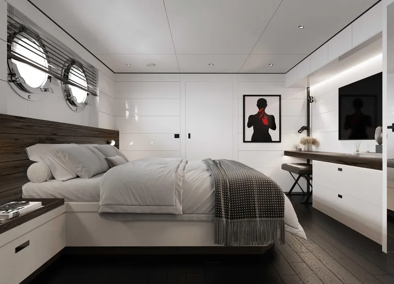 Slide: The Image of Luxurious yacht bedroom with modern decor, featuring a cozy bed, artwork, and porthole windows. - 25