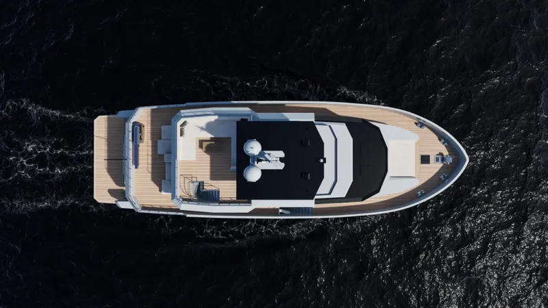 Slide: The Image of Top view of 2027 Custom Tufan and Brothers Mako Shark yacht on dark water. - 28